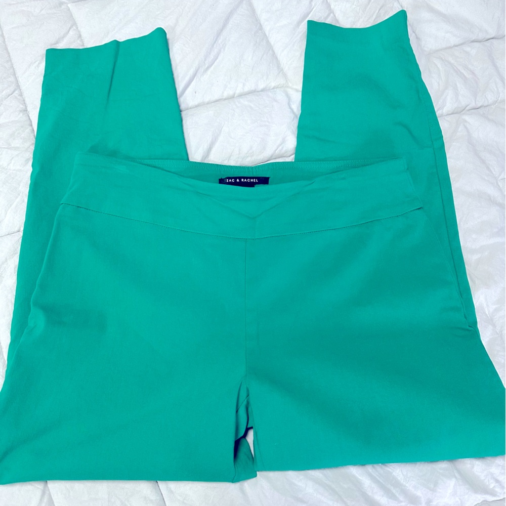 Ankle length pull on pants with grommet detail at ankle